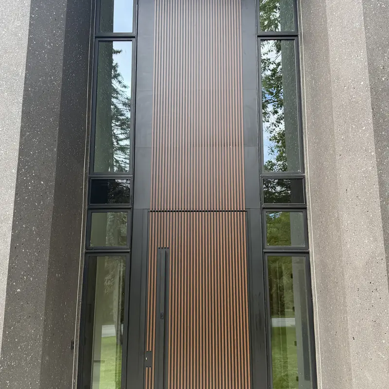 Wood-slat pivot door with glass sidelites, Mississauga
