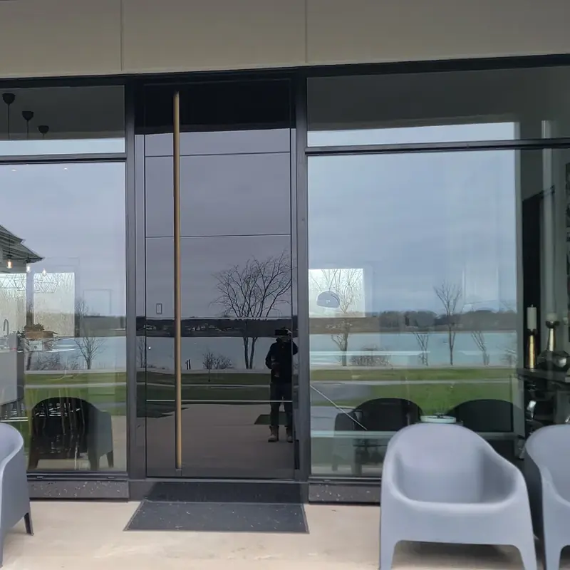 Pivot door in a wall of glass