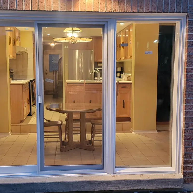 White patio door at dusk