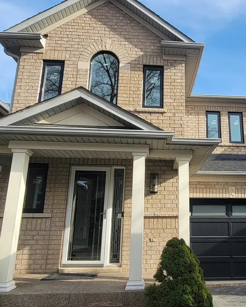 Black garage door, entry and windows